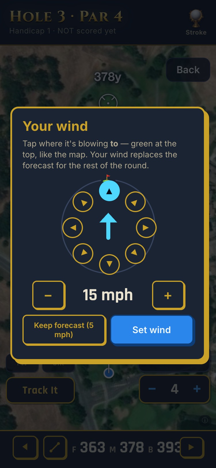 Battle Tees wind dial on hole 3 at Rancho Solano: a ring of eight direction buttons around the green, the arrow set toward the green, 15 mph on the stepper, with buttons to keep the 5 mph forecast or set your own wind